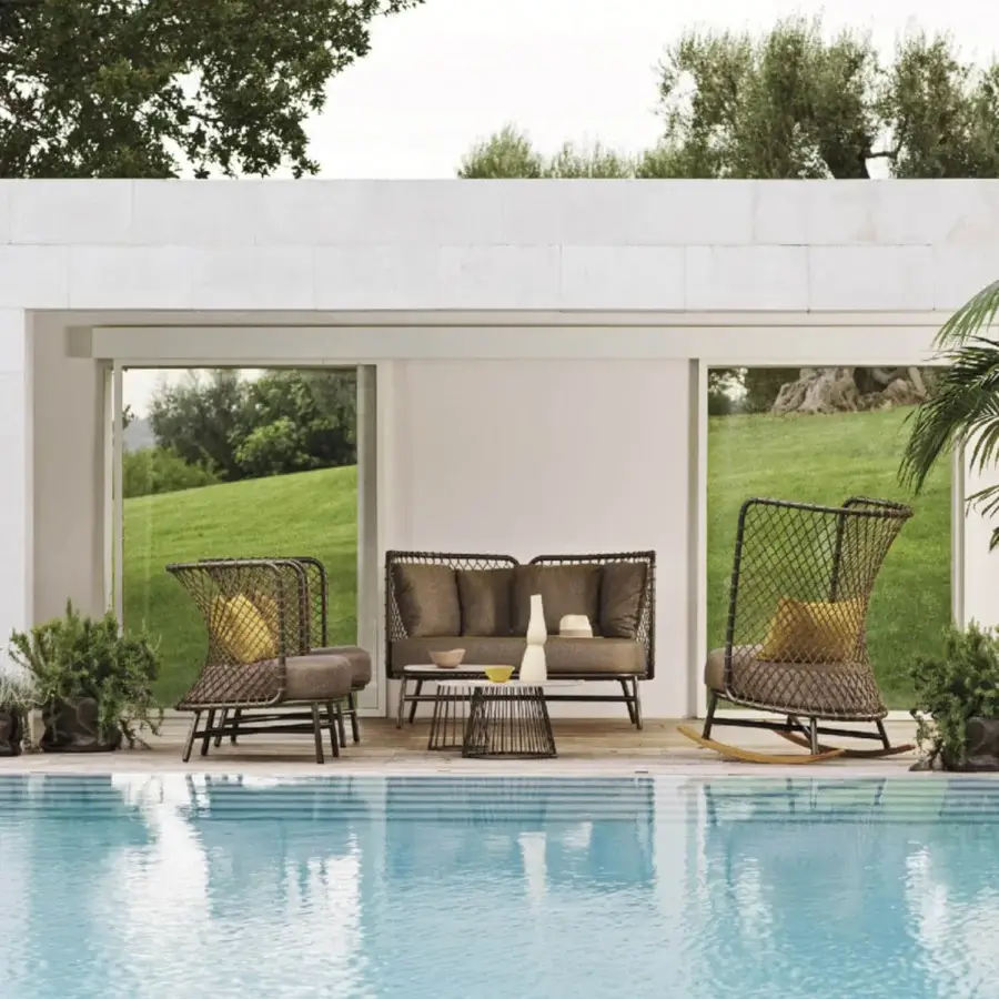 Distinguished Roberti Rattan Charme lounge chair crafted with powder-coated 304 steel and Flat Trendyrope in a muted grey-brown tone
