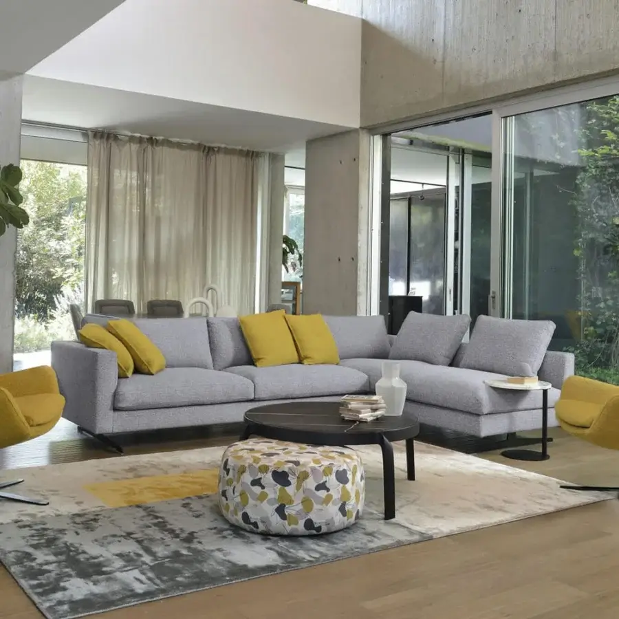 Refined CTS Salotti Grace lounge chair with vibrant yellow textile upholstery and sleek black metal swivel base