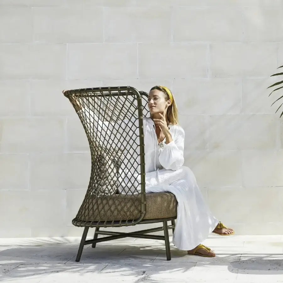 Distinctive Roberti Rattan Charme relax lounge chair crafted with earthy brown and green Flat Trendyrope and powder-coated 304 steel