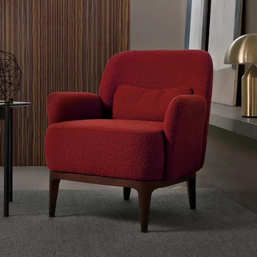 Exquisite CTS Salotti Margot lounge chair upholstered in reddish-orange bouclé fabric with satin finished wooden legs