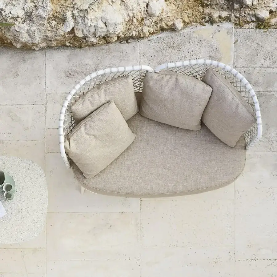 Lavish Roberti Rattan Charme sofa built with matte white powder-coated steel and neutral beige Flat Trendyrope cushions