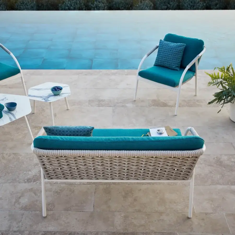 Superior Roberti Rattan Capri sofa crafted with teal cushions, durable searope and powder-coated aluminum frame