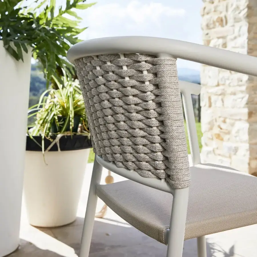 Sophisticated Roberti Rattan Lipari armchair crafted with woven Oval Seaprope and powder-coated aluminum frame