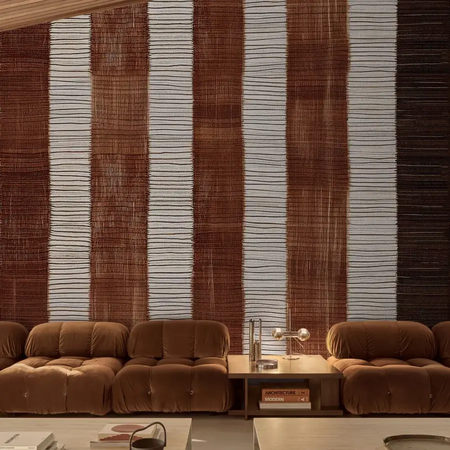 Distinguished Wall&Decò Tracciante wallpaper exhibits warm brown vertical stripes with a luxurious fabric-effect finish on bio-vinyl d.ecodura™ Texture substrate