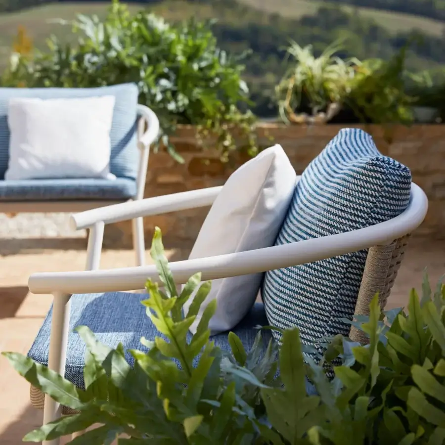 Distinguished Roberti Rattan Lipari lounge chair with woven Oval Seaprope detail in blue shades and matte white powder-coated aluminum frame