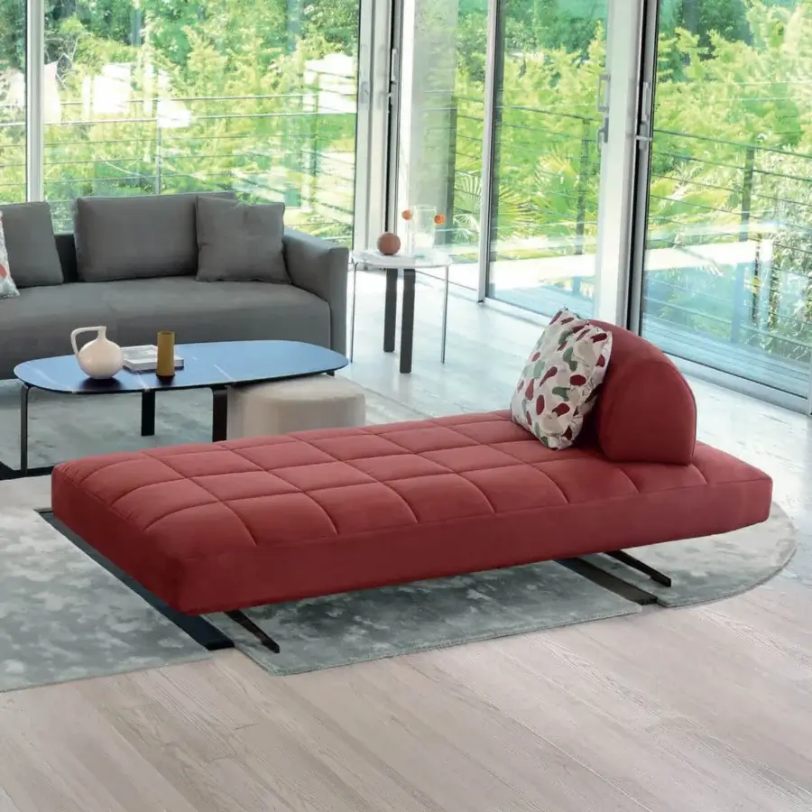 Distinguished CTS Salotti Ikon chaise lounge upholstered in plush terracotta textile with chrome metal legs and quilted detailing