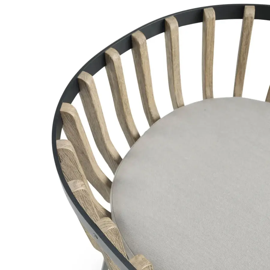 Distinguished Ethimo Swing armchair with a cozy rounded form built in teak slats and muted gray textile upholstery
