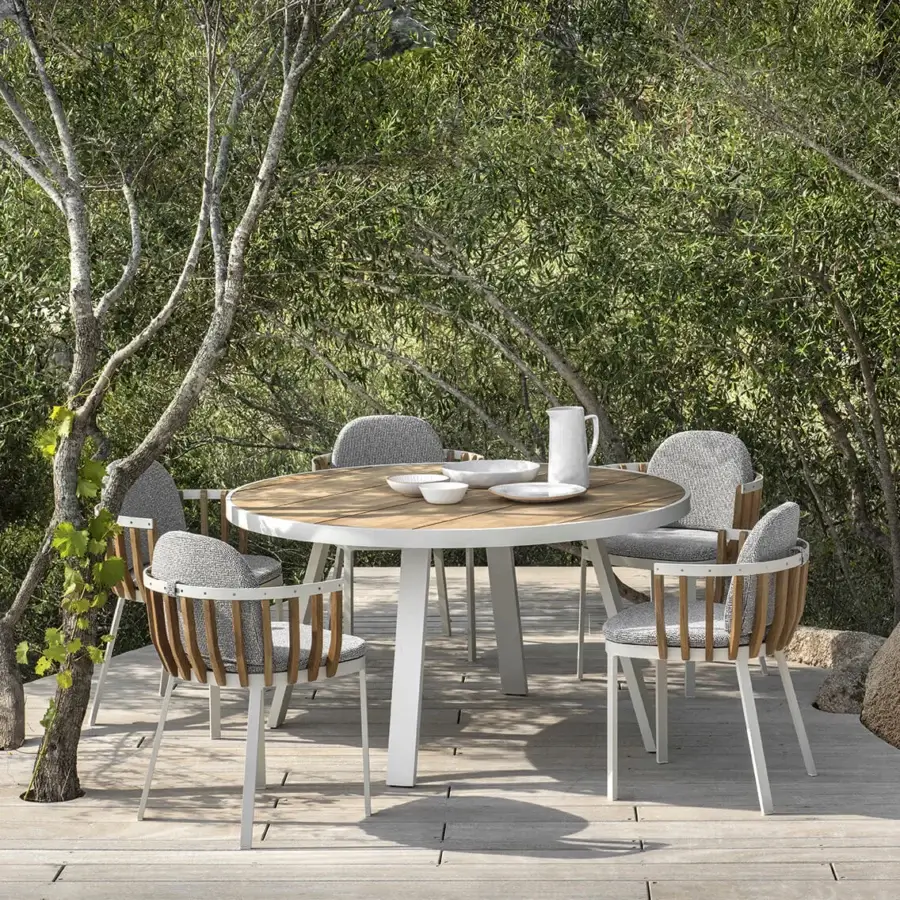 Distinguished Ethimo Swing armchair with a white architectural metal frame and precisely arranged teak slats in muted gray textile cushioning