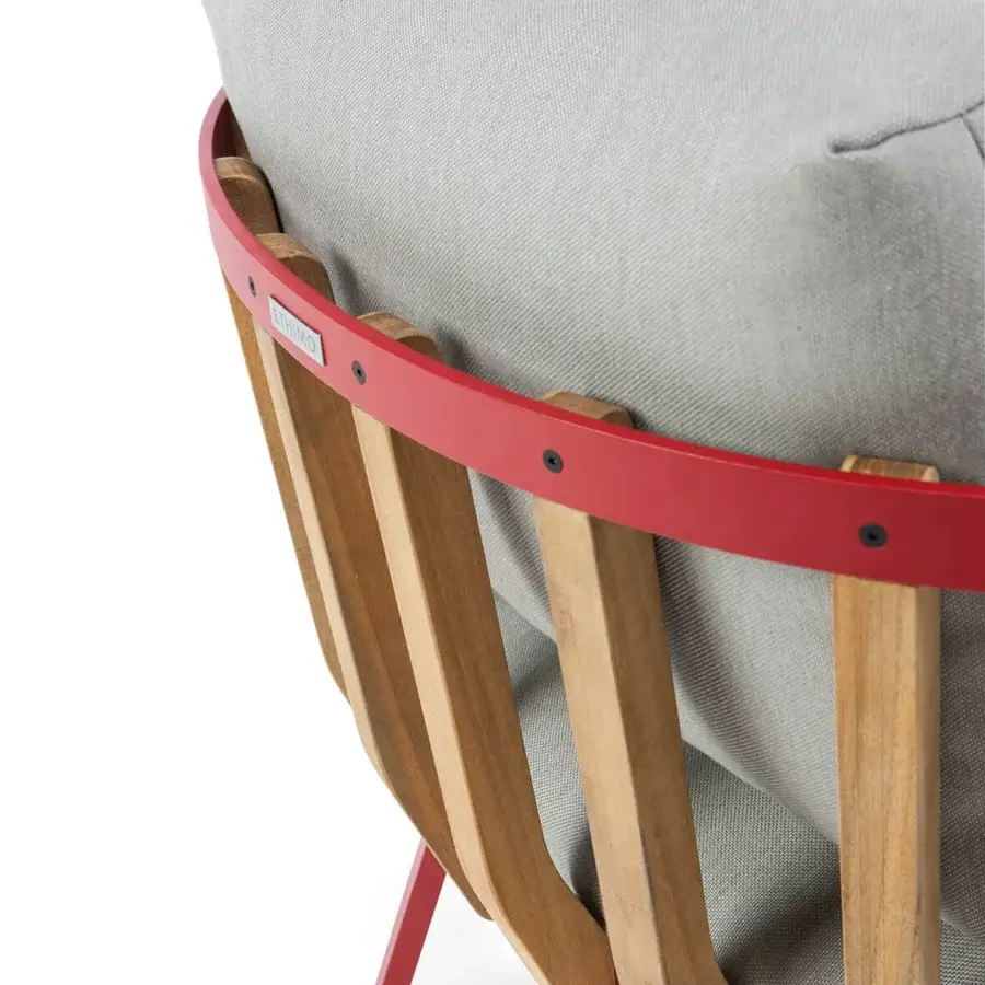 Innovative Ethimo Swing lounge chair with a vibrant red metal frame and precisely arranged teak slats