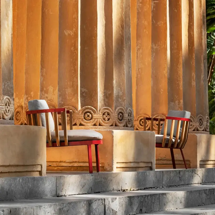 Meticulous Ethimo Swing lounge chair with reddish-brown matte metal, natural teak slats and light gray textile cushion