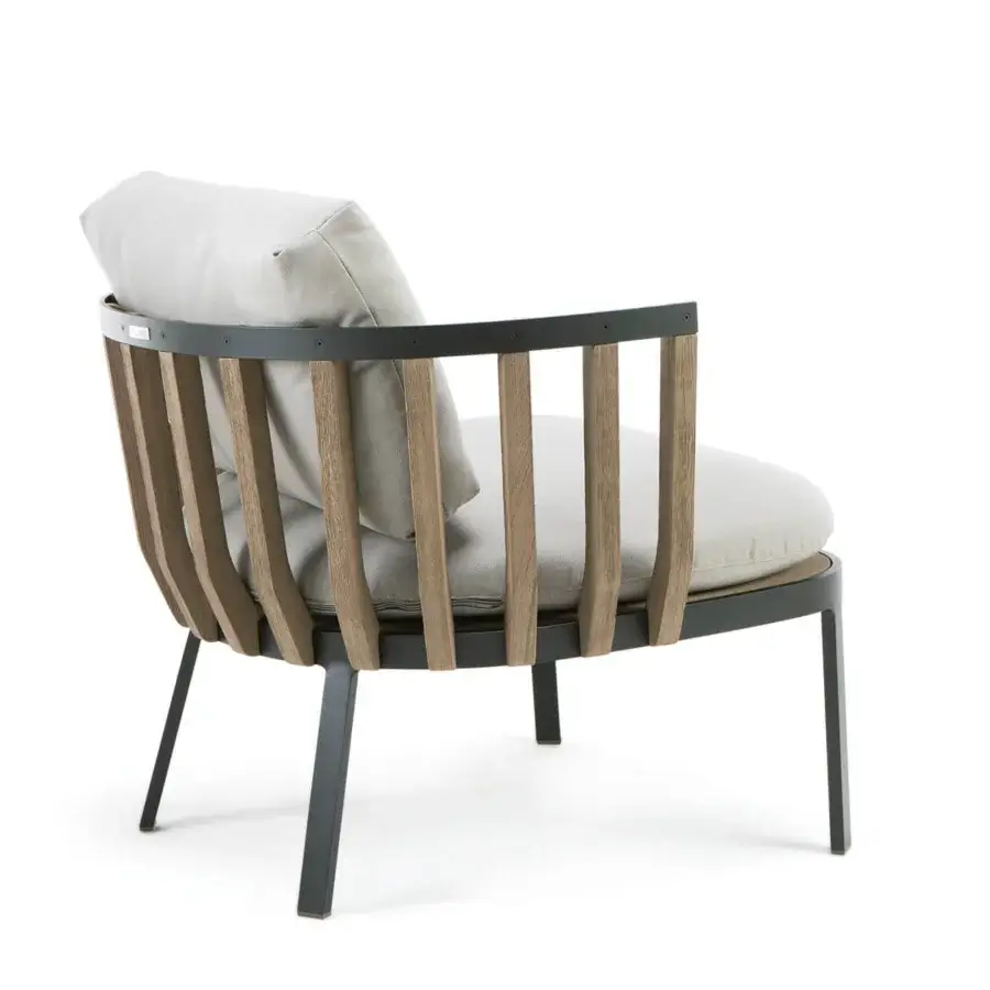 Distinguished Ethimo Swing lounge chair with dark metal framing and teak slats, enhanced by light gray textile cushioning