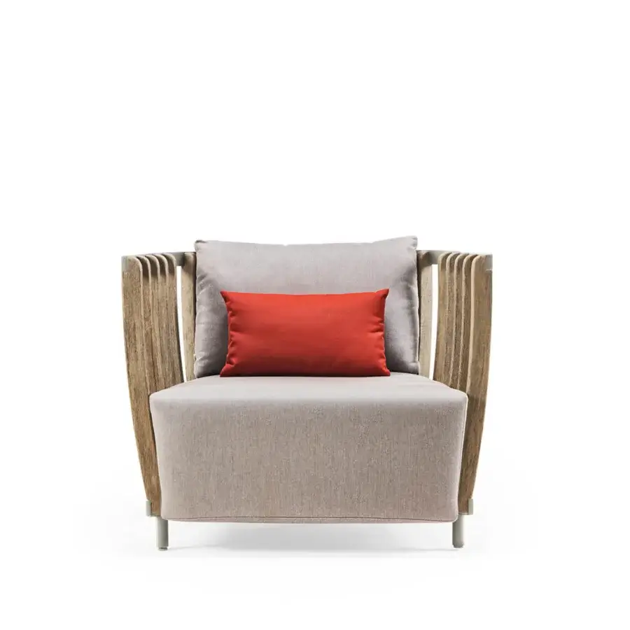 Distinguished Ethimo Swing lounge chair with metal frame and internal teak slats finished in a lightly textured satin sheen, plus gray cushions and a reddish-orange throw