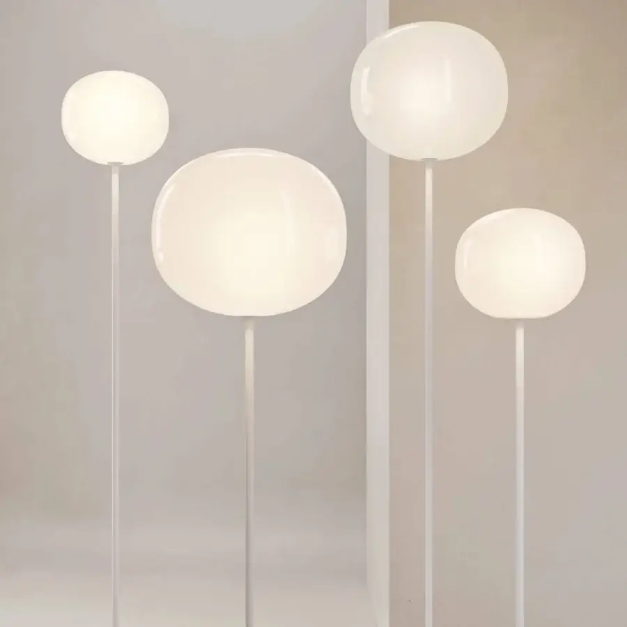 Exceptional Lodes Volum floor lamp with organically rounded glossy white blown glass and matte metal stem