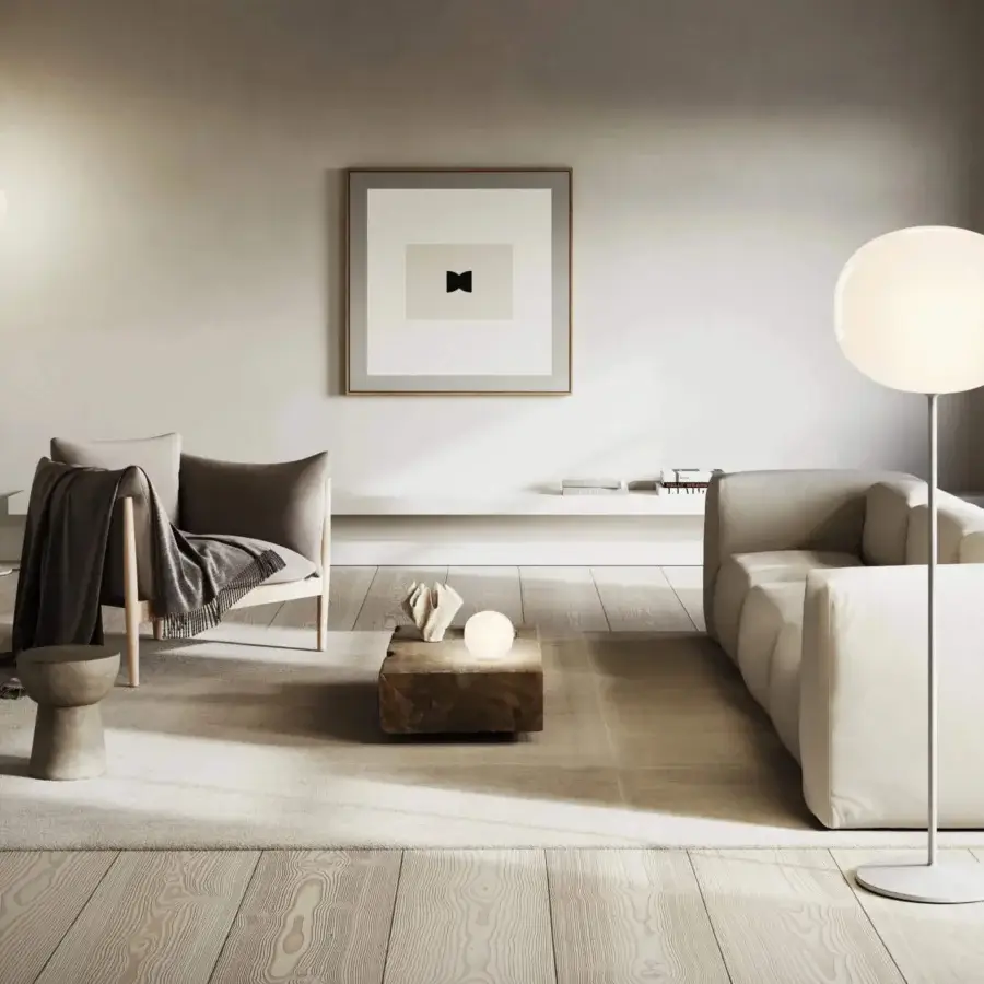 Distinguished Lodes Volum floor lamp crafted in Italy with glossy white blown glass and smooth metal stem for all-round illumination
