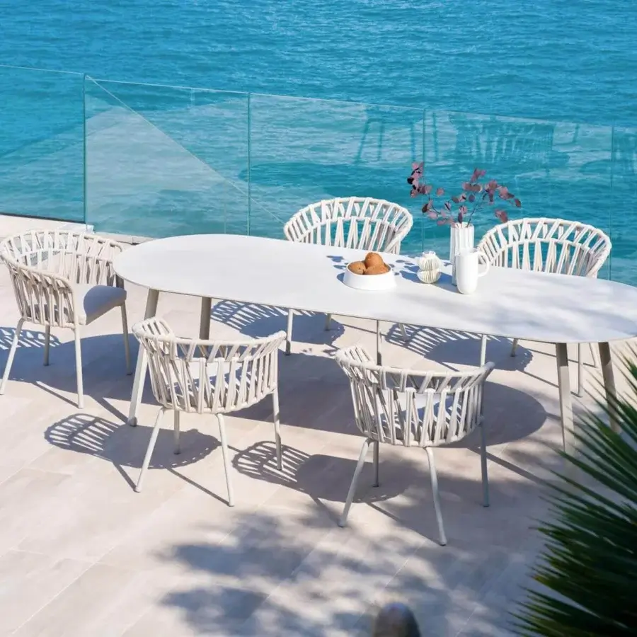 Distinguished Varaschin Emma Cross armchair with woven light beige acrylic bands and powder-coated aluminum frame