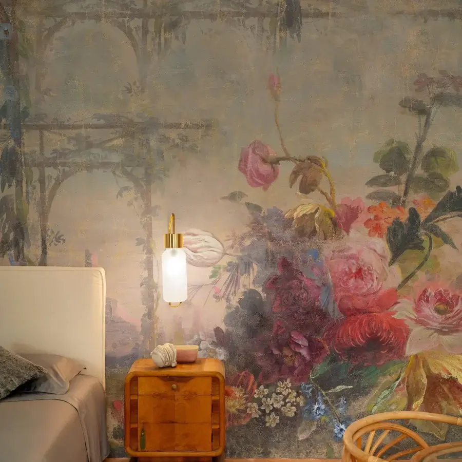 Distinguished Wall&Decò Once Upon A Time wallpaper with muted florals and faded architectural details in organic bio-vinyl with d.TW finish