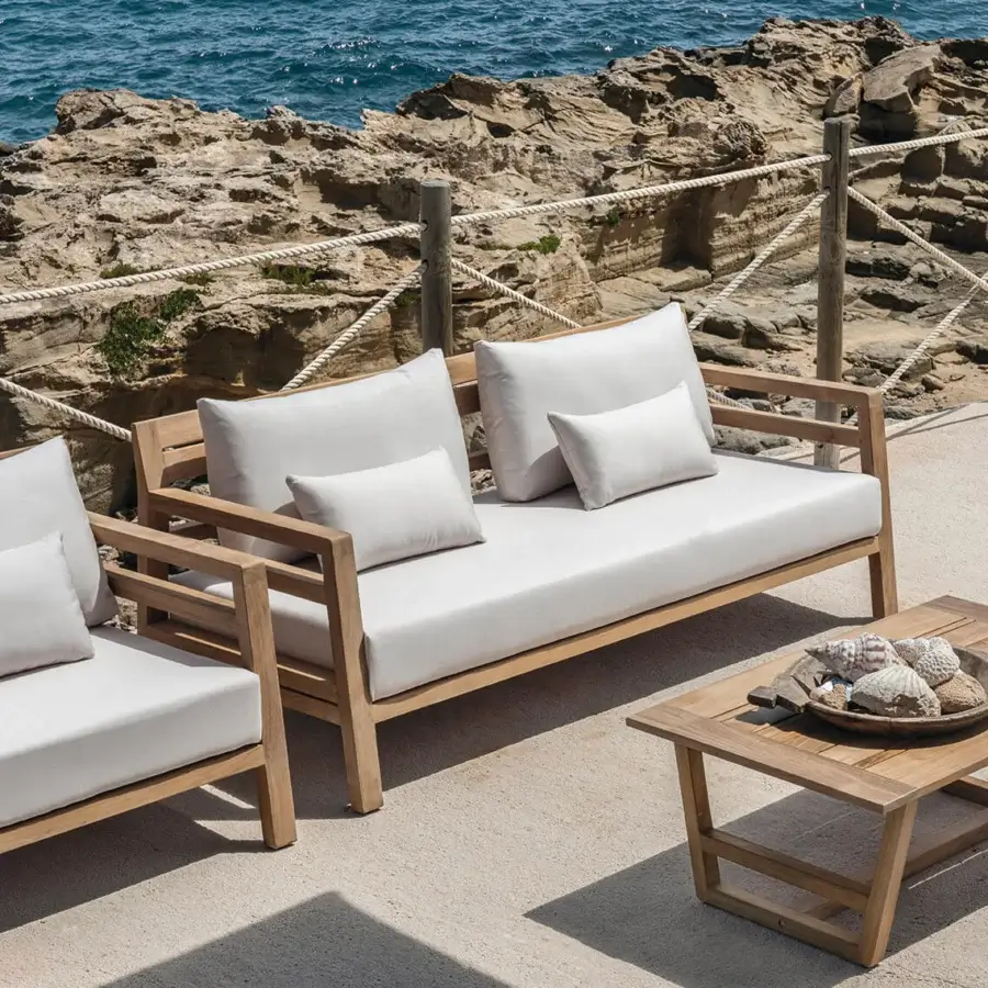 Exceptional Ethimo Costes sofa crafted with FSC-certified teak wood in a worn pickled finish with light beige cushions