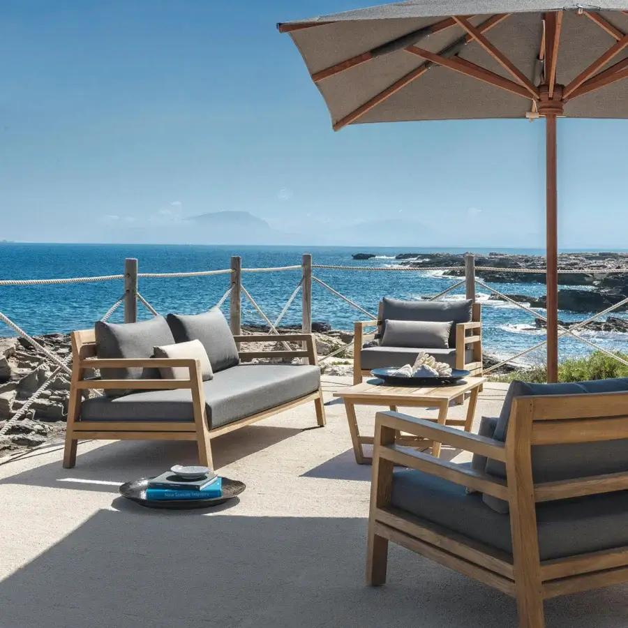 Distinguished Ethimo Costes sofa crafted with FSC-certified teak in a worn pickled finish for relaxed outdoor living