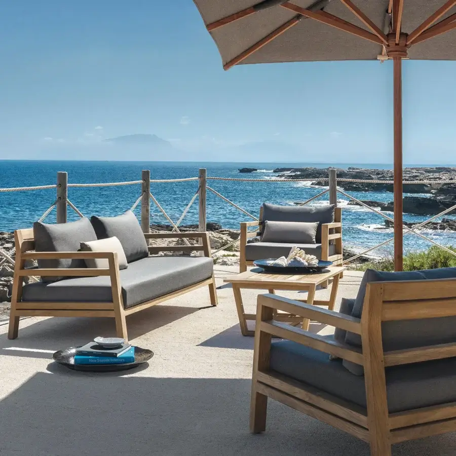 Distinguished Ethimo Costes lounge chair with FSC-certified teak and a dark gray cushion in a charming pickled finish