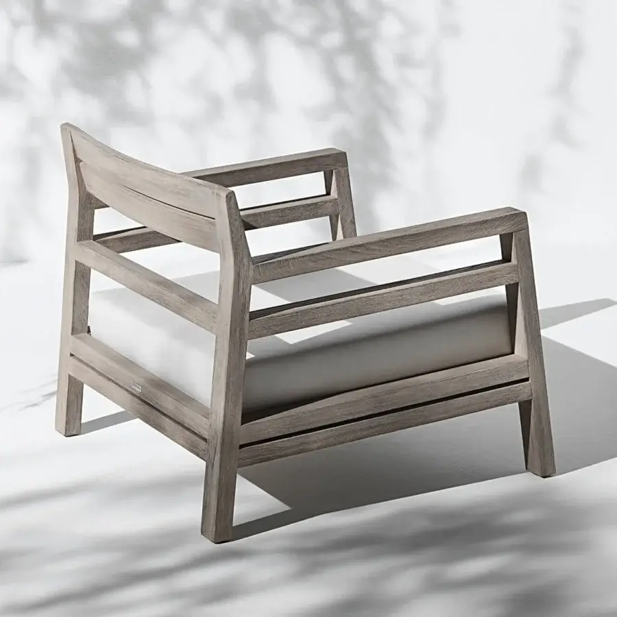Exceptional Ethimo Costes lounge chair with FSC-certified teak and lighter gray cushion in a worn pickled finish