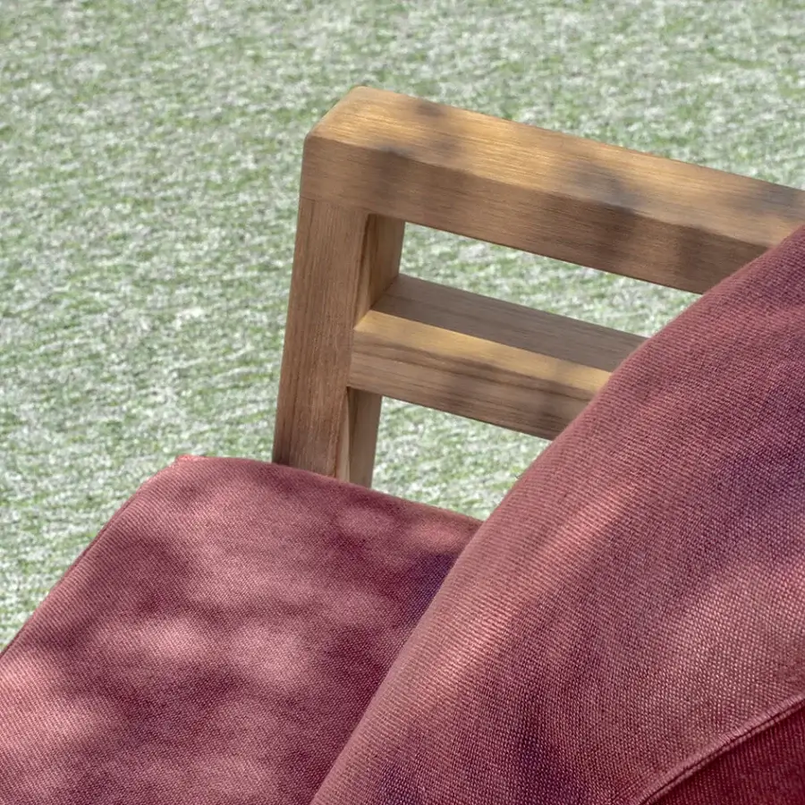 Lavish Ethimo Costes lounge chair with reddish-burgundy textile cushions and pickled FSC-certified teak frame
