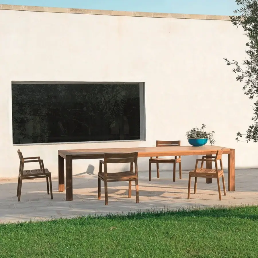 Distinguished Ethimo Costes armchair with FSC-certified teak structure and warm natural finish offers ergonomic design