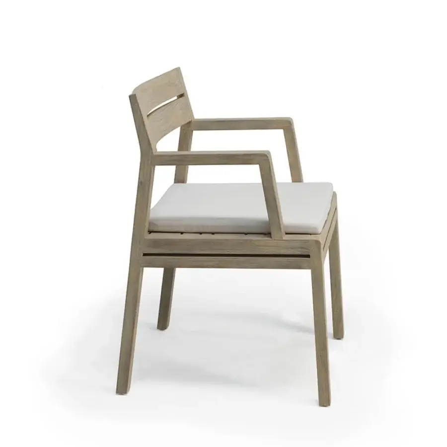 Superior Ethimo Costes armchair crafted with FSC-certified teak and a warm natural finish for harmonious outdoor relaxation