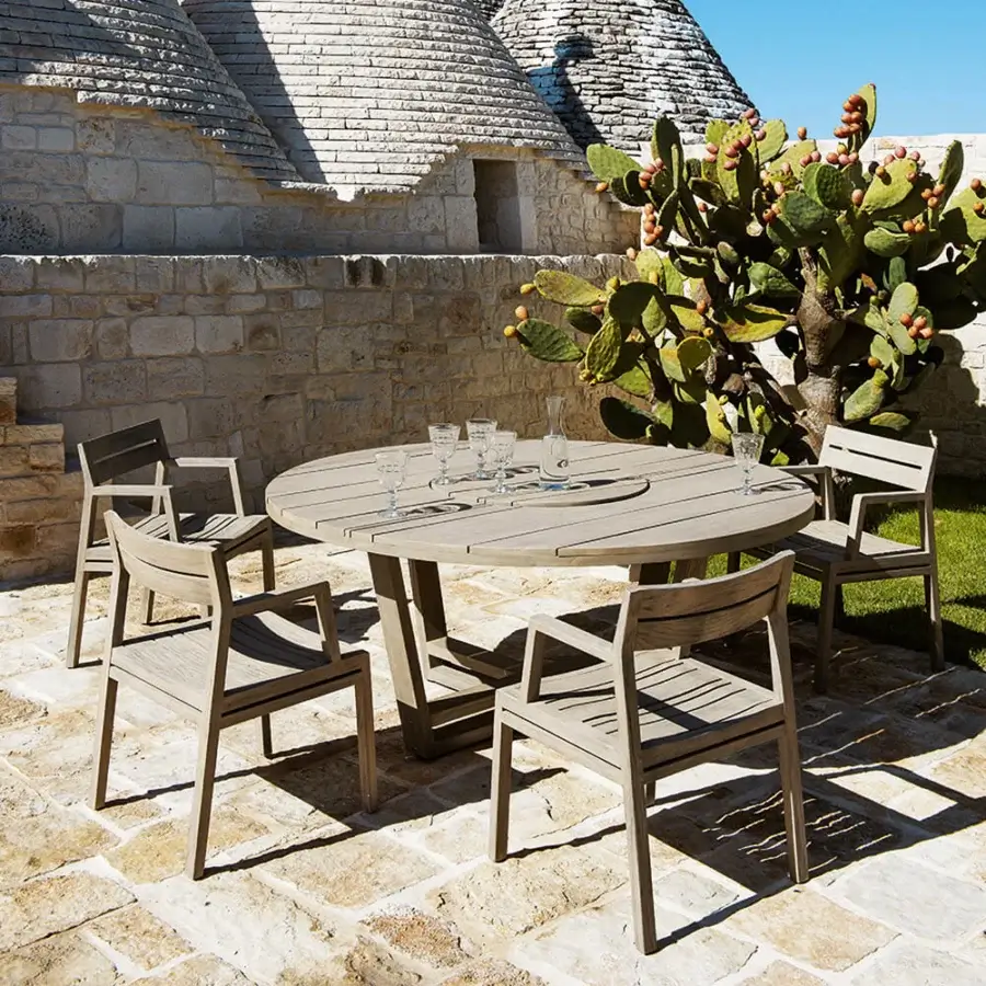 Elegant Ethimo Costes armchair crafted with FSC-certified teak and a charming pickled finish in a muted greyish-brown tone