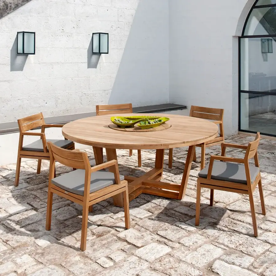 Distinguished Ethimo Costes armchair crafted with FSC-certified teak and light gray cushions offering a warm natural finish