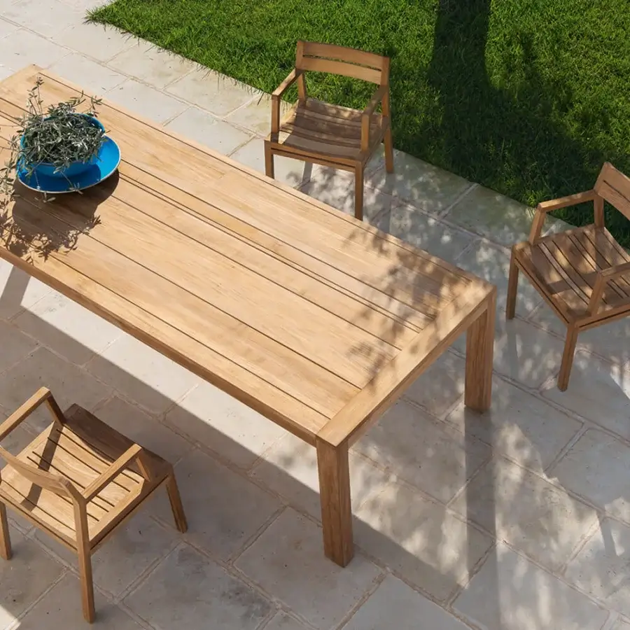 Distinguished Ethimo Costes table crafted in natural teak with a pickled finish exhibiting a signature slatted design