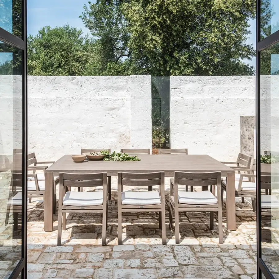 Exceptional Ethimo Costes table crafted in FSC-certified natural teak with a muted grey-brown finish and slatted top