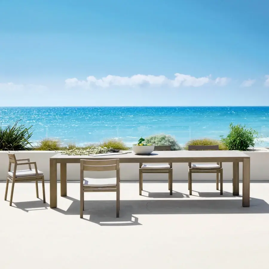 Elegant Ethimo Costes table crafted in medium-toned brown FSC-certified natural teak with a slatted top