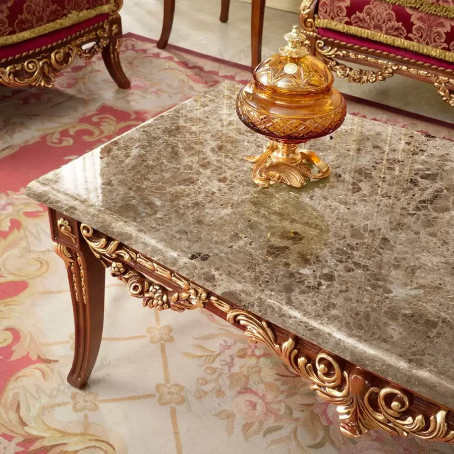 Exquisite Modenese Rubino Delight coffee table crafted with a polished marble top and solid wood in reddish-brown finish with gold-leaf carvings