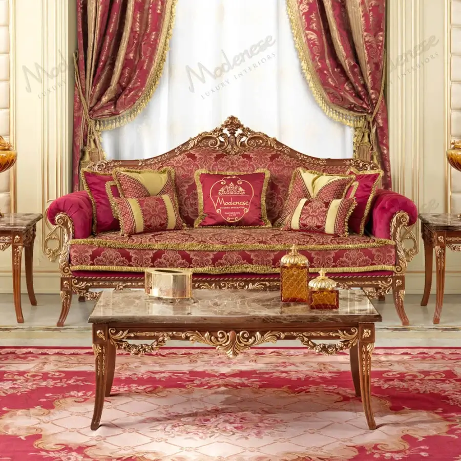 Lavish Modenese Rubino Delight coffee table crafted with polished marble top and solid wood with gold-leaf carvings