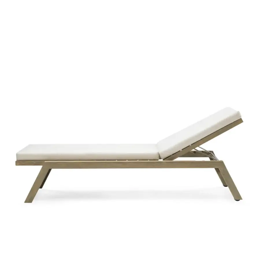 Distinguished Ethimo Costes lounger crafted with FSC-certified teak presenting a charming worn look and light neutral brown finish