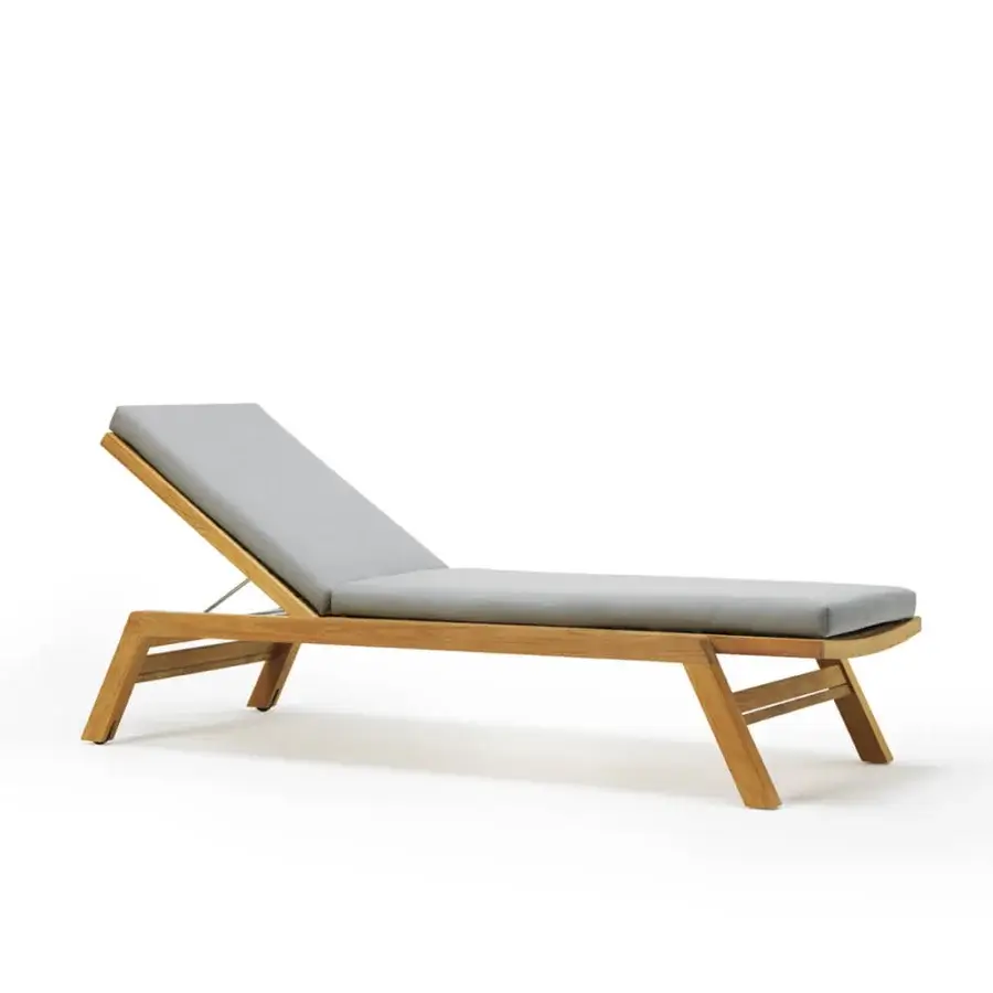Harmonious Ethimo Costes lounger crafted with FSC-certified teak and light gray cushions presenting a charming worn finish