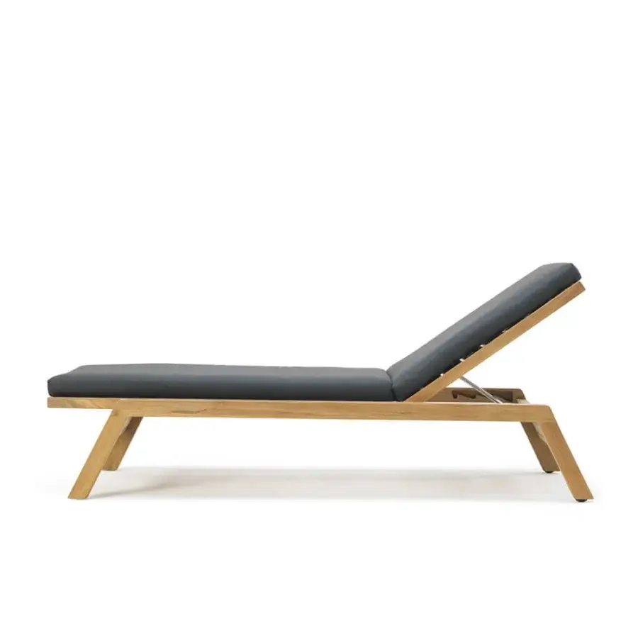 Superior Ethimo Costes lounger crafted in FSC-certified teak with a natural finish and dark gray cushion