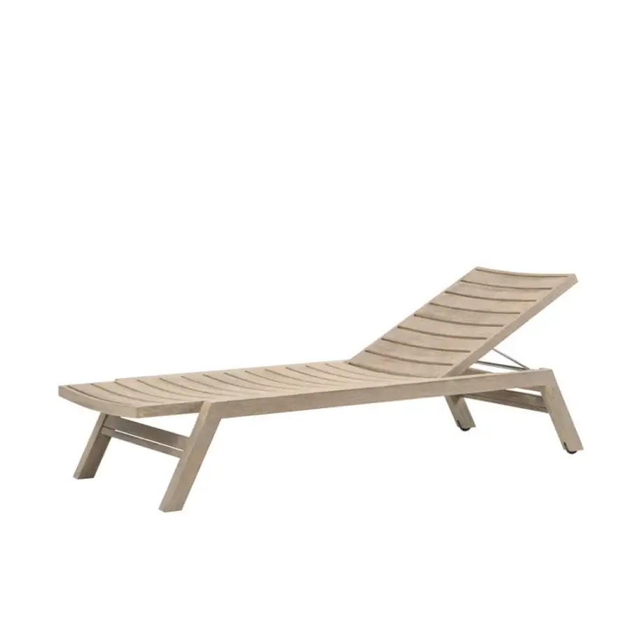 Elegant Ethimo Costes lounger crafted in FSC-certified teak with a warm natural finish and curved silhouette