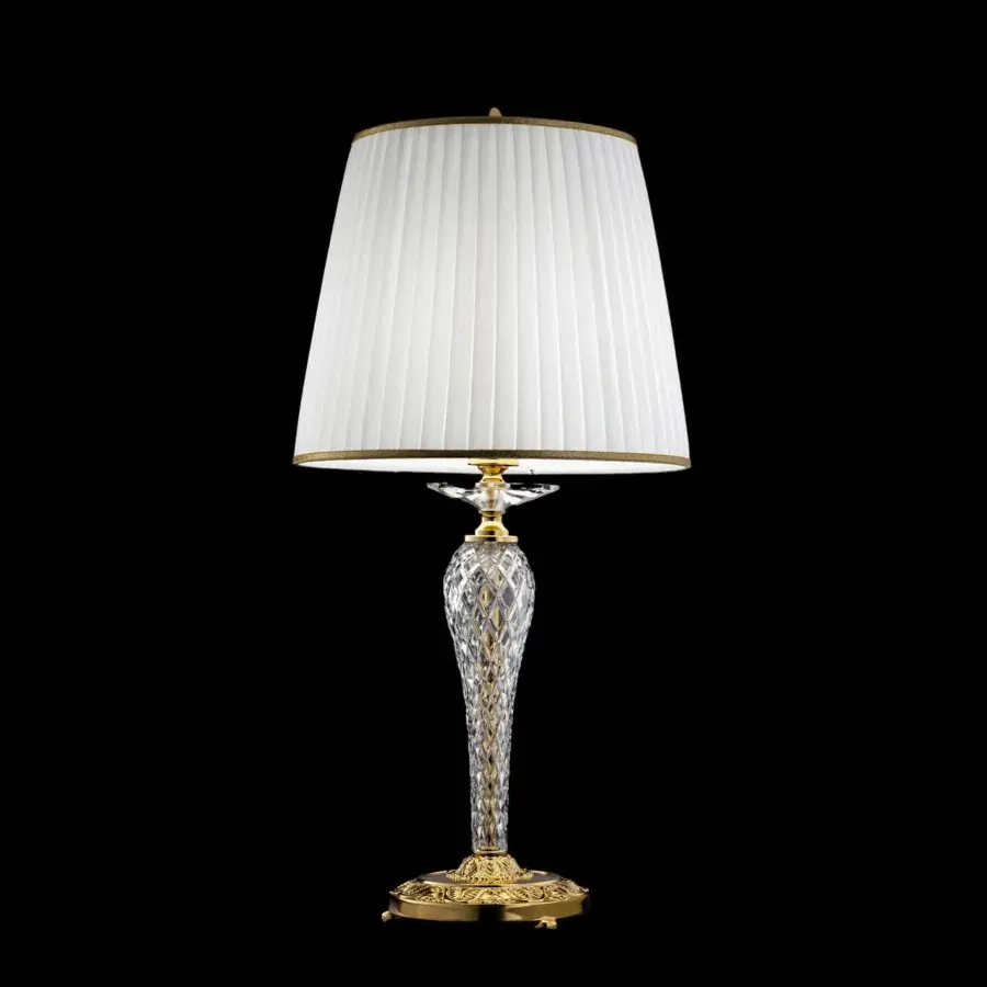 Elegant Laudarte Carina table lamp with sculpted clear crystal column and bronze castings in luminous 24K gold-plated finish