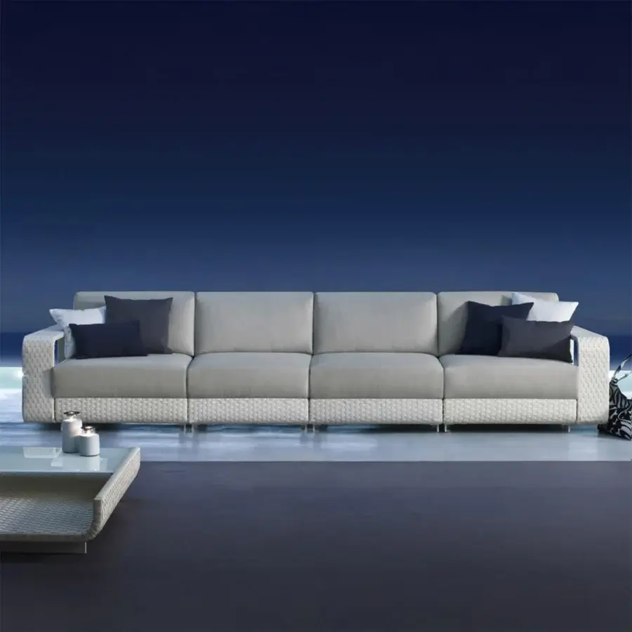 Superior Roberti Rattan Hamptons sofa crafted with aluminum, light gray Sunweave textile, and darker gray woven base