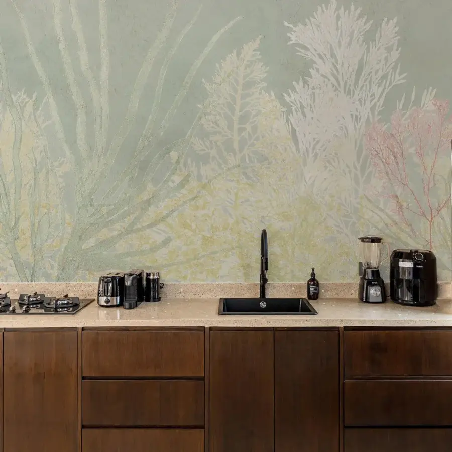 Distinguished Wall&Decò Algife wallpaper with delicate seaweed and coral silhouettes in sage green, pale yellow, and off-white with a matte finish
