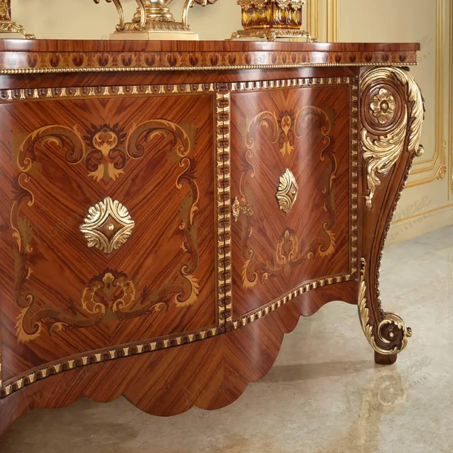 Lavish Modenese Rubino Delight sideboard with reddish-brown wood, gold leaf carvings and gracefully curved lines exhibiting polished finish
