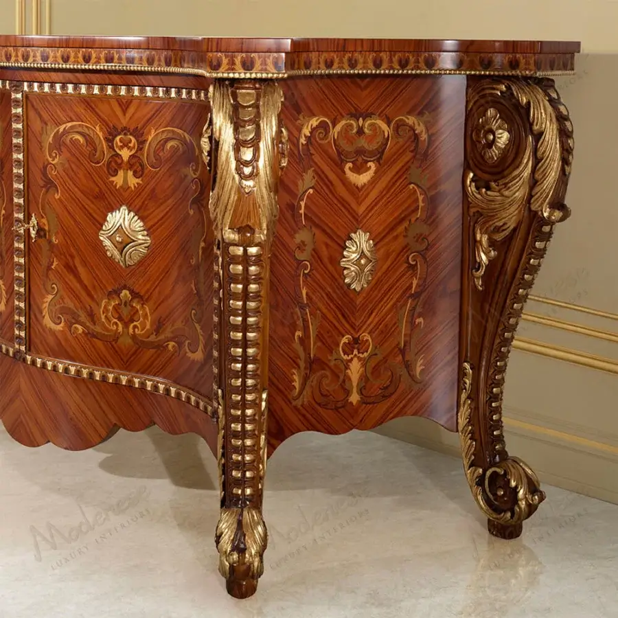 Distinguished Modenese Rubino Delight sideboard in reddish-brown wood with intricate gold leaf carvings and sculpted legs