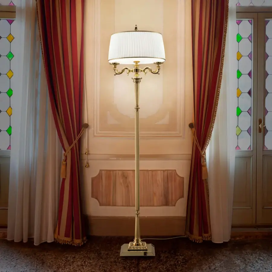 Distinguished Laudarte Alya floor lamp crafted in bronze with a luminous 24K gold-plated finish and off-white pleated lampshade