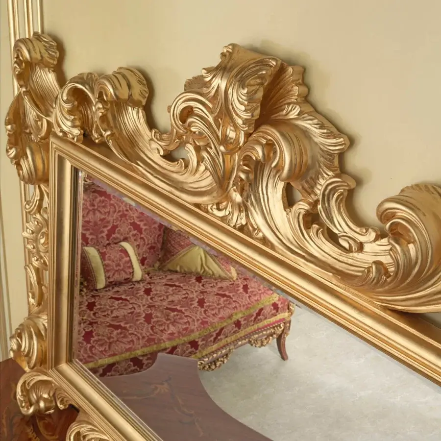 Exquisite Modenese Rubino Delight mirror crafted in glossy gold with ornate scrolling patterns and floral motifs