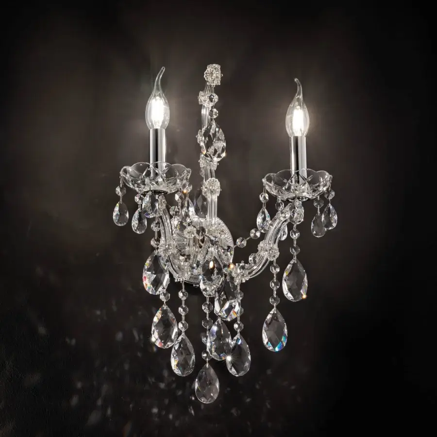 Distinguished Laudarte Celeste wall lamp crafted in bright palladium plated structure with delicate clear Asfour crystal pendants exhibiting graceful symmetry