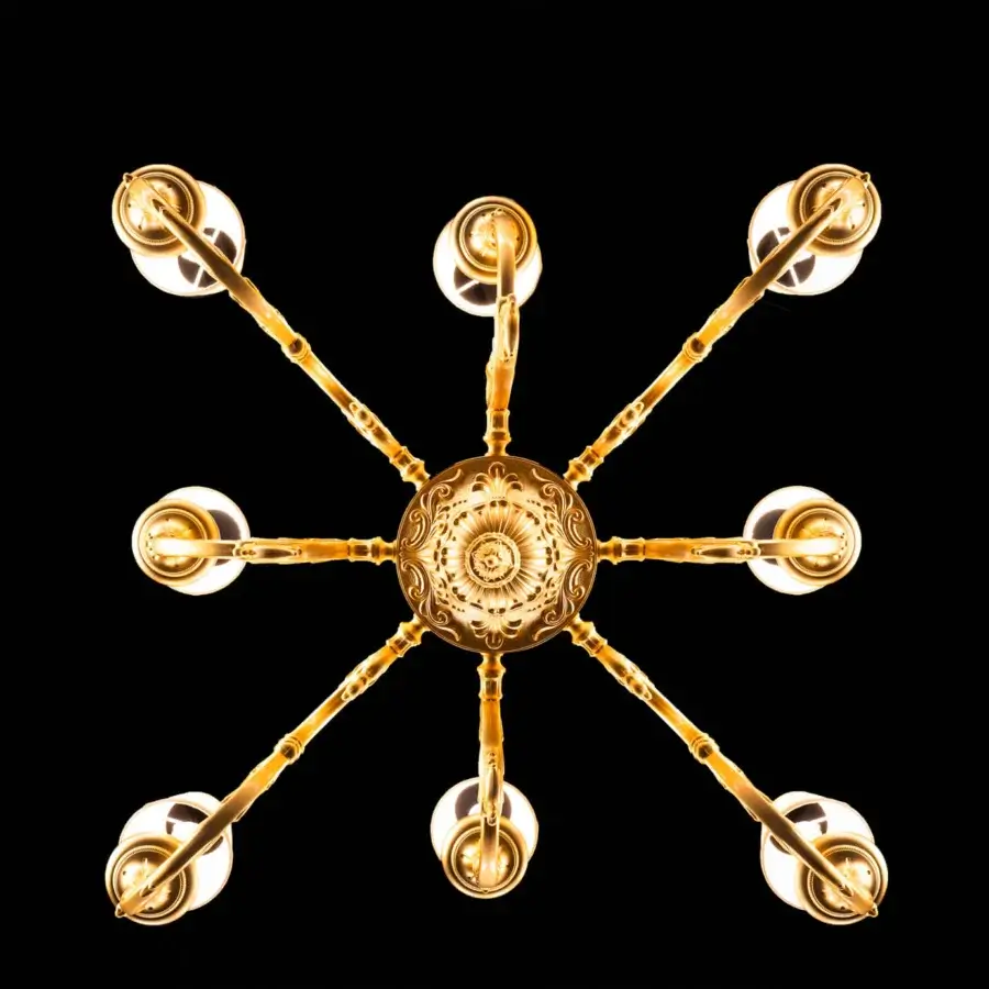 Lavish Laudarte Iperione chandelier crafted in bronze with radiant 24K ancient gold plating and ornate detailing