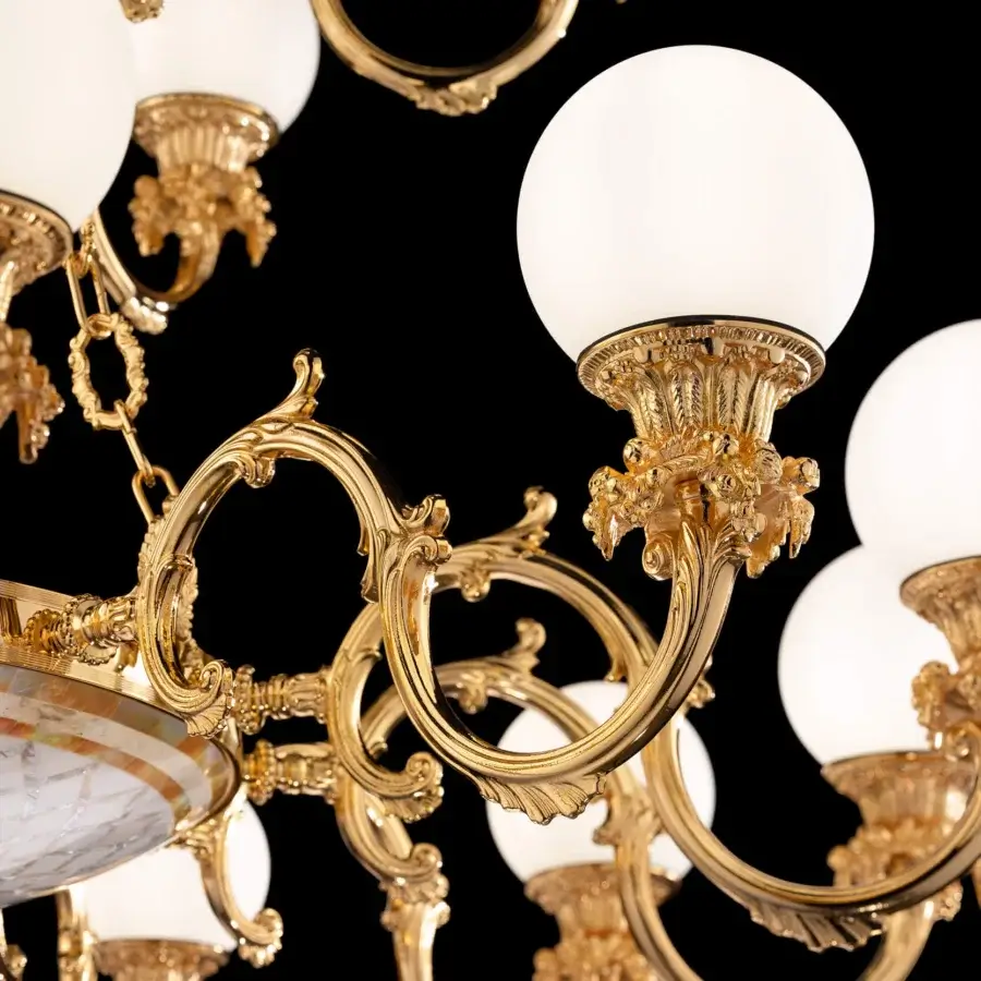 Distinguished Laudarte Sole chandelier handcrafted in bronze with radiant 24K gold plating and stone mosaic detailing