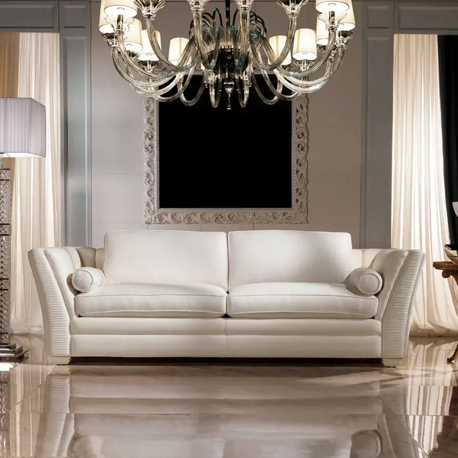 Elegant Zanaboni Amalfi sofa with a low profile and curved silhouette in off-white matte textile and luxurious goose down cushions