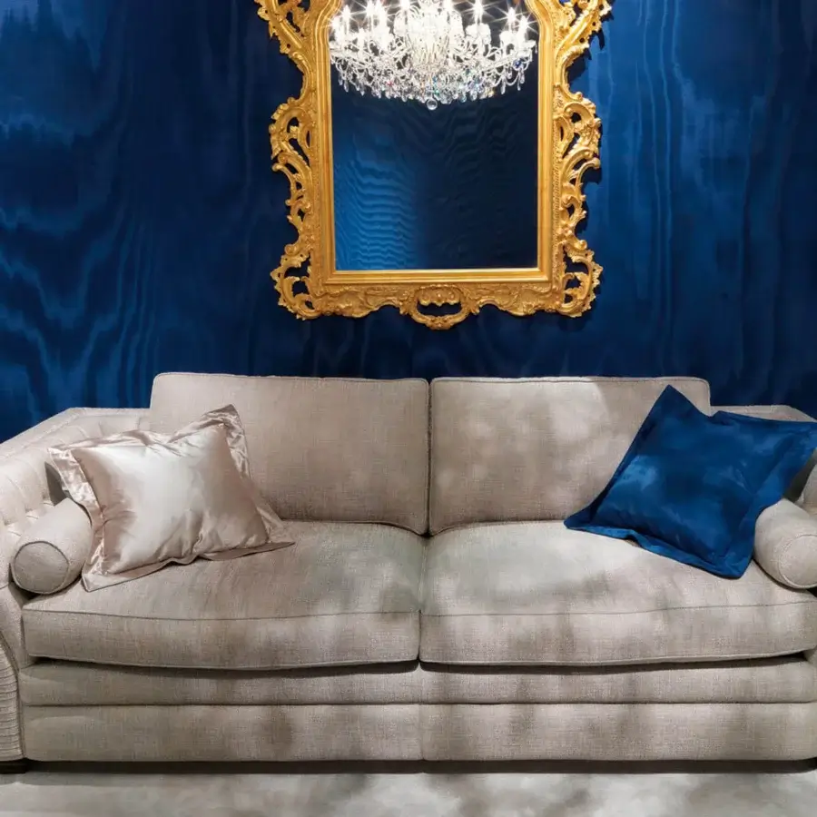 Exceptional Zanaboni Amalfi sofa upholstered in textured beige-grey textile with deep blue accent cushions and a solid wood frame